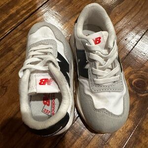 New Balance Kids Boots with Gray Uppers and Brown Soles